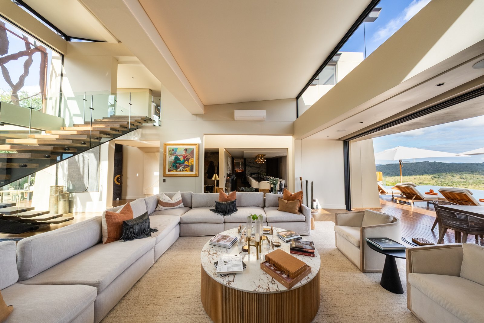 Double volume living room at Villa Thandawena opening to the reserve
