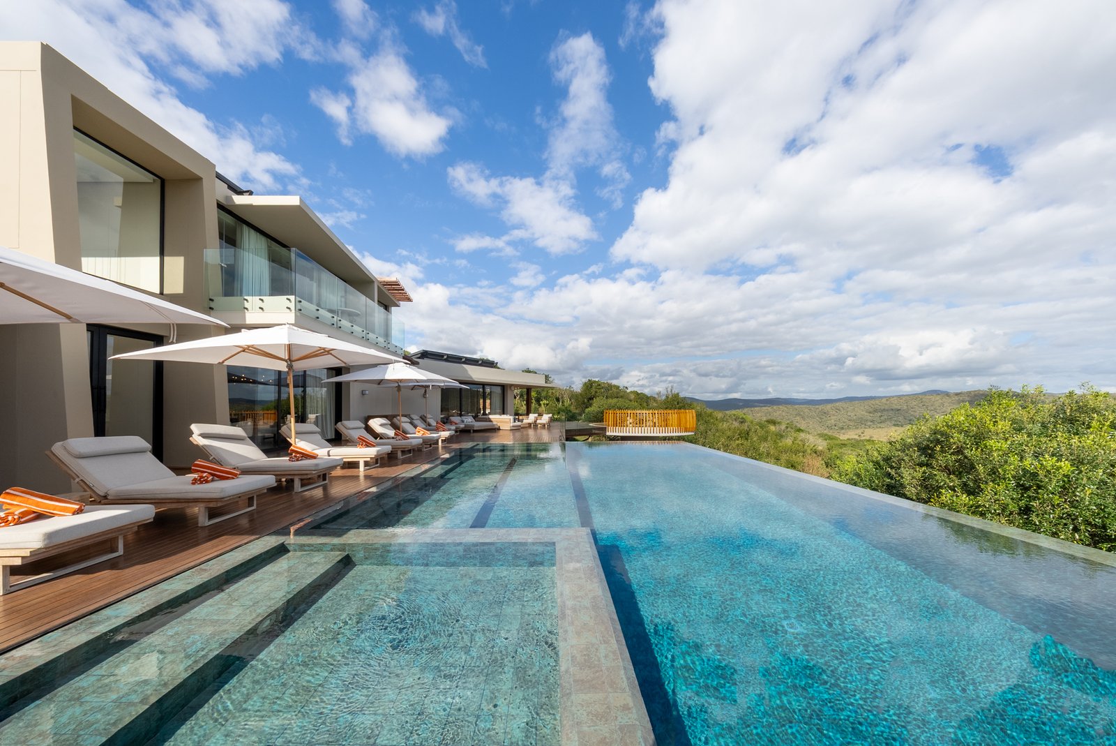 Loungers along the pool terrace at Villa Thandawena